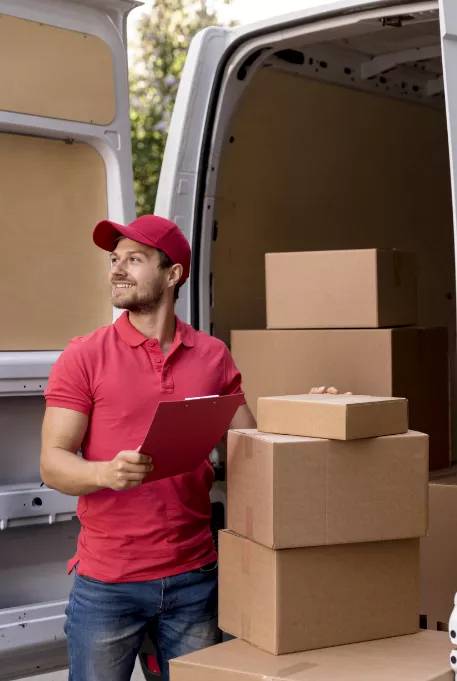 Movers holding a checklist infront of a truck